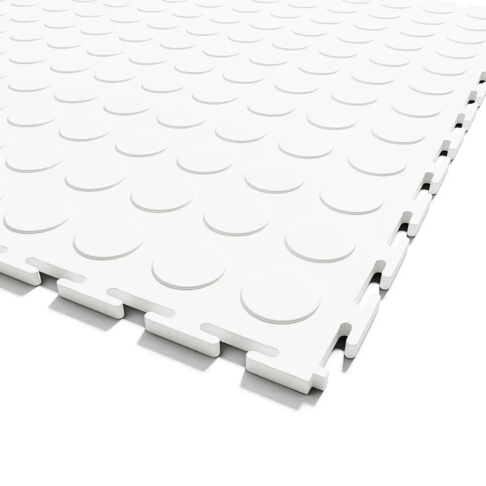 Extreme close-up of the Flexspec VinylFlex Pro Coin industrial PVC tile in Arctic White, showing the solid core construction and heavy-duty hidden interlocking system.
