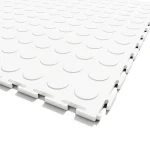 Extreme close-up of the Flexspec VinylFlex Pro Coin industrial PVC tile in Arctic White, showing the solid core construction and heavy-duty hidden interlocking system.