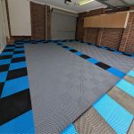 Spacious double garage featuring SmoothFlex Flat Top vented tiles in a grey parking zone with a black and blue custom border.